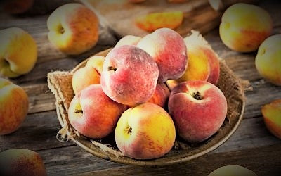 Fresh peaches ready for making Lavender Apricot & Peach Jam, featuring local fruit and a hint of lavender.
