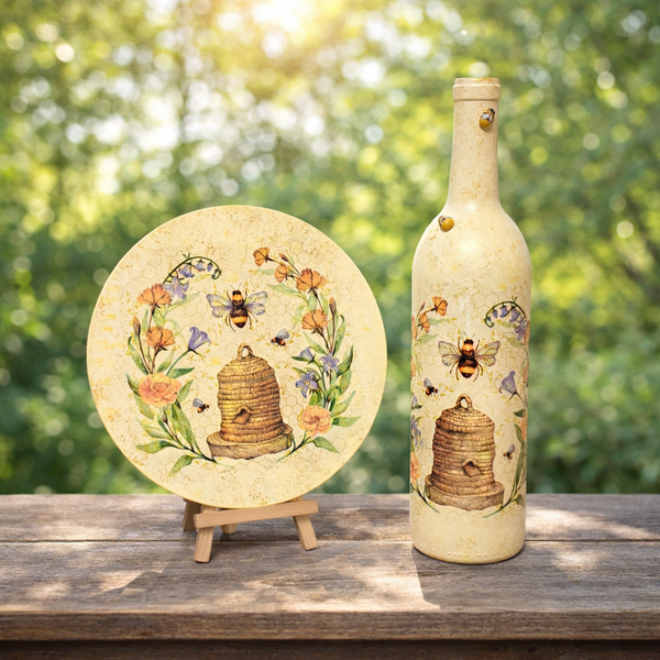 Bee-themed decoupage plate on a stand and matching bottle with beehive, bees, and floral border.