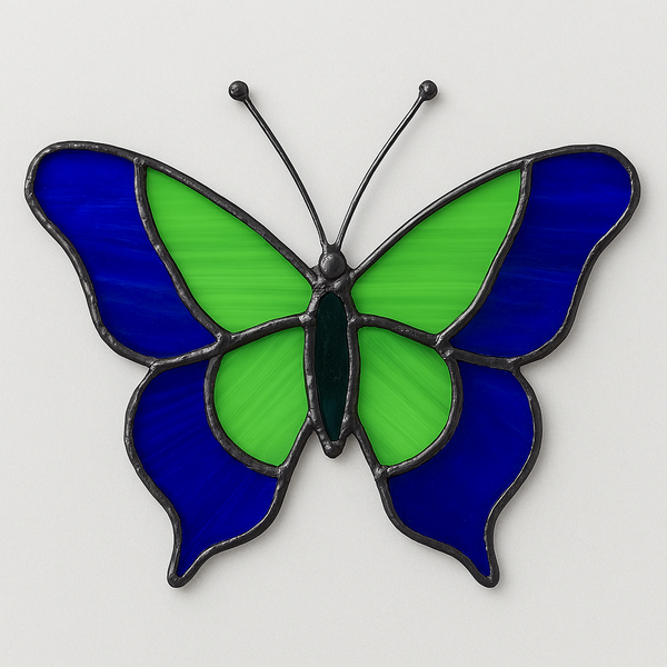 Flutter & Sip stained glass butterfly artwork in blue and green panels.